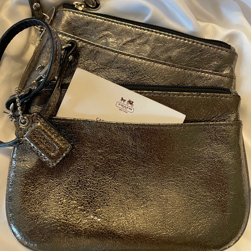 Coach metallic wristlets or little wallet